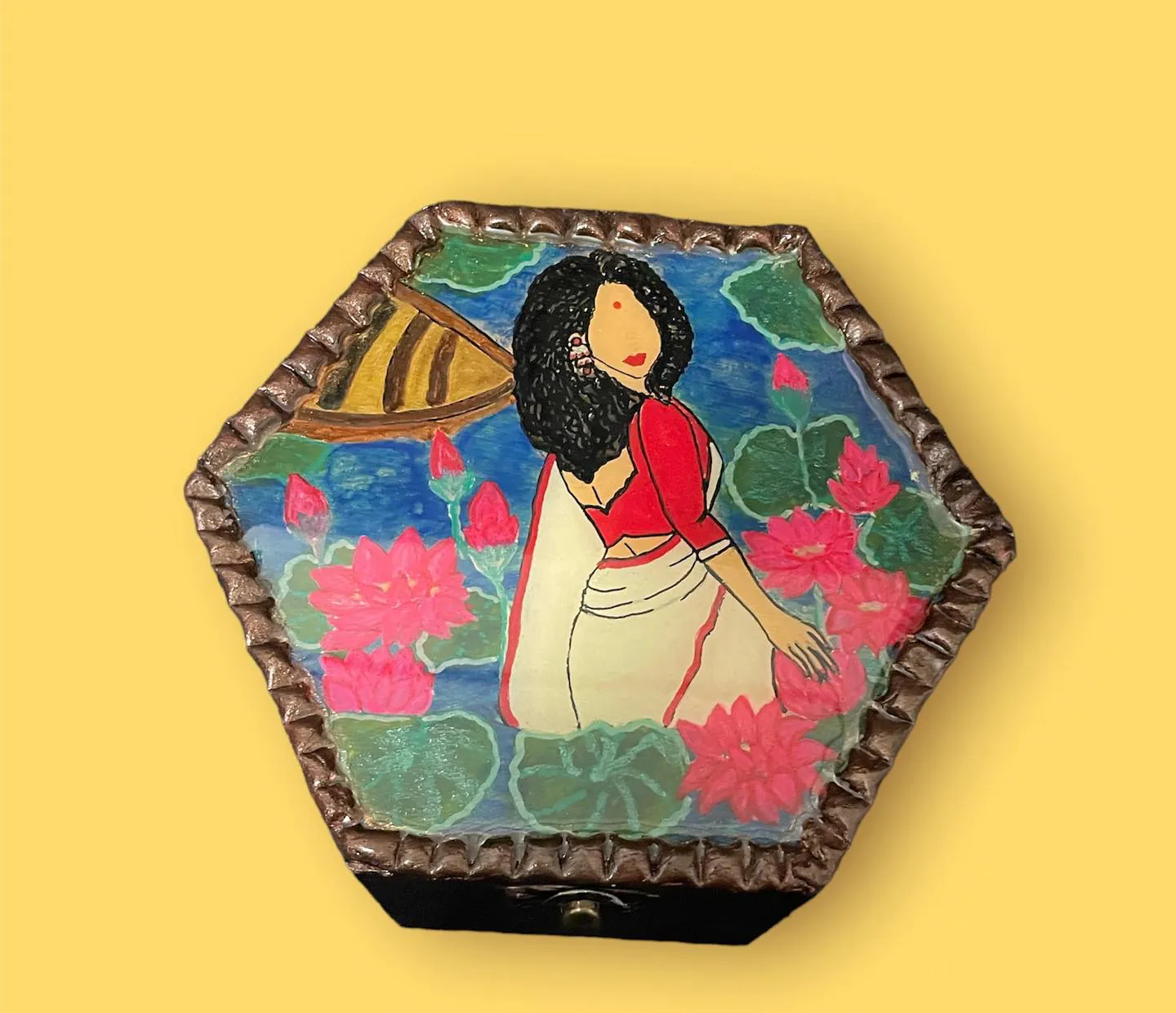 Hexagonal wooden jewellery box hand-painted with a woman in a red-bordered white saree among lotus flowers