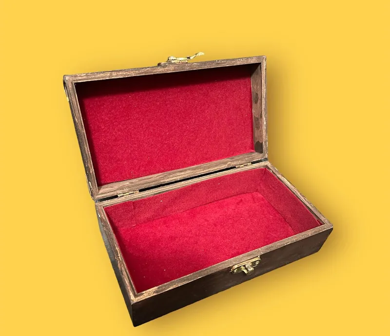 Rectangular jewellery box open, showing red velvet lining